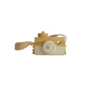 white wooden toy camera